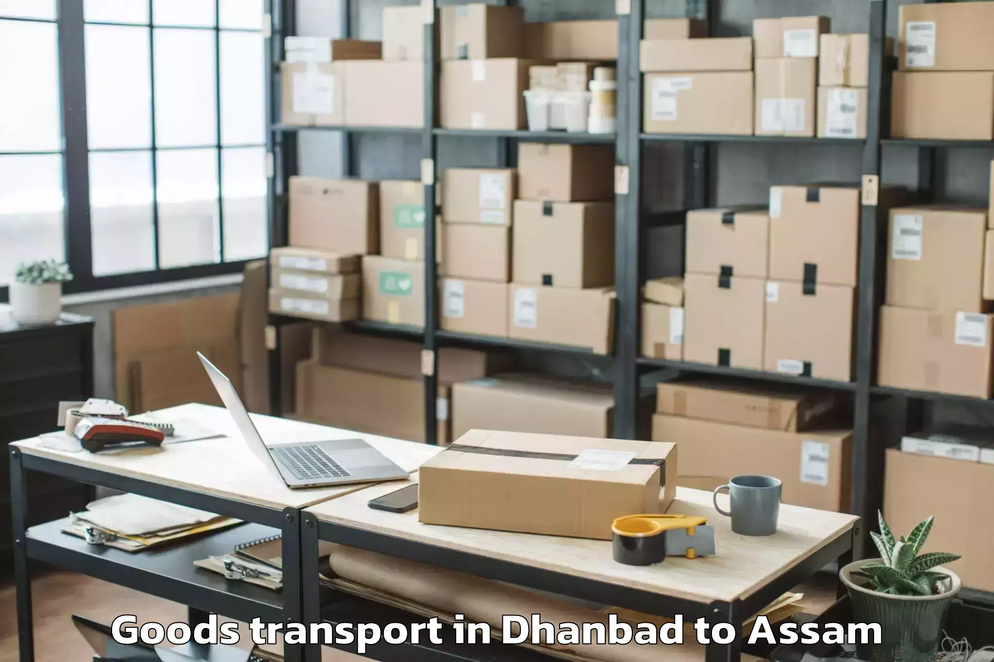 Professional Dhanbad to Makum Goods Transport